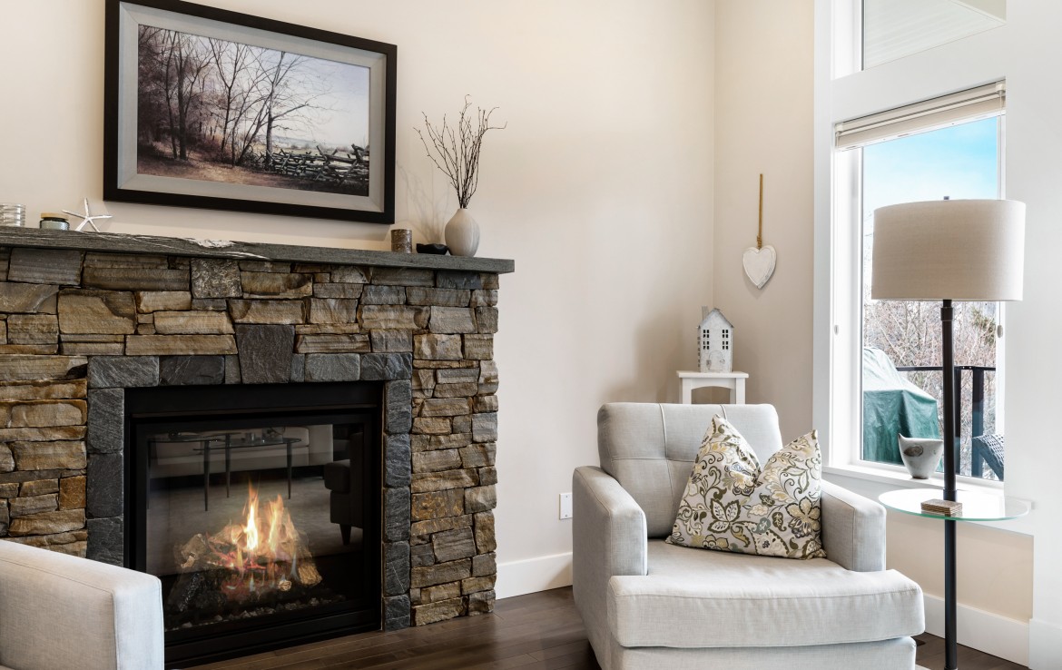View of the stone fireplace with mantel.