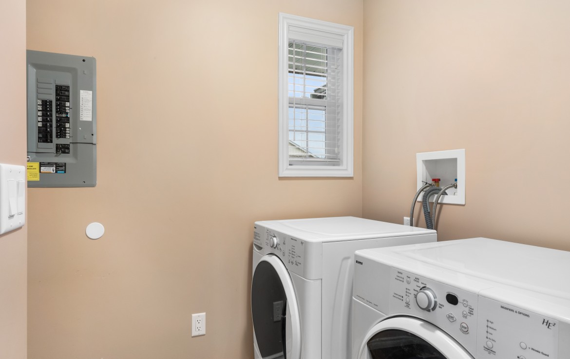 laundry room with front loading washer and dryer.