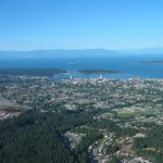 Aerial view of the city of Nanaimo towards the Sunshine Mountains on the mainland.
